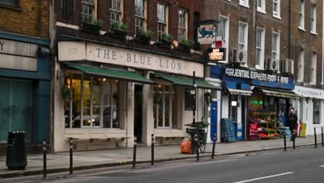 Walking-towards-The-Blue-Lion-Pub,-London,-United-Kingdom