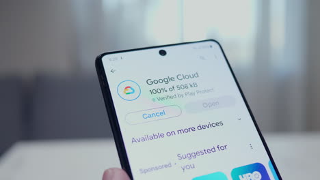 Close-up-of-an-individual-installing-the-Google-Cloud-application-in-a-smart-mobile-phone