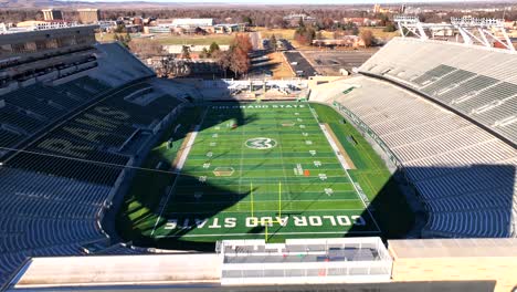 Aerial-Drone-flying-Low-over-Colorado-State-University-Football-Stadium-in-Fort-Collins-,-Colorado,-USA-on-a-winter-day-