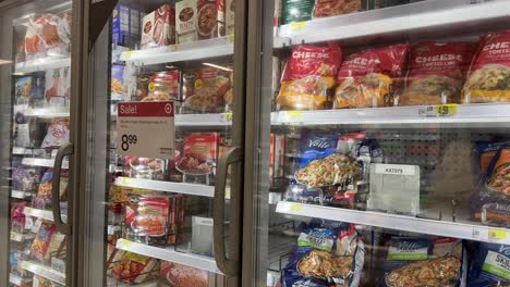 Frozen-bagged-family-sized-meals,-food-in-grocery-store-aisle-section-on-sale