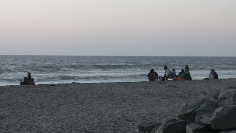 People-on-a-beach-in-Carlsbad-California-during-sunset