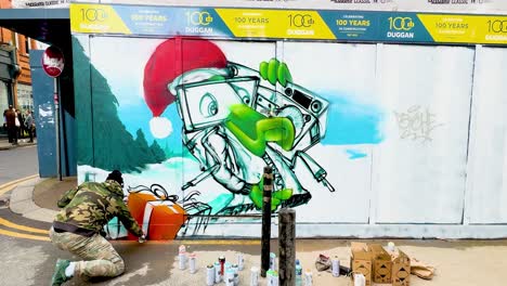 In-4K-a-Street-Artist-paints-a-mural-on-a-hoarding-of-a-building-site