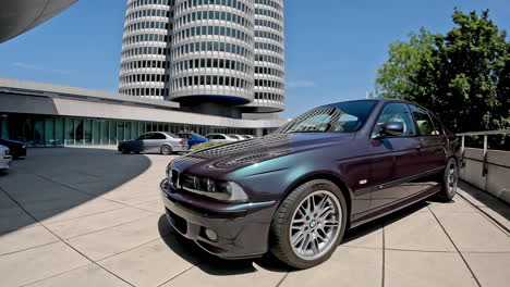 Timeplapse-view-of-purple-BMW-M5-E39-car-on-display-at-Munich-museum-for-visitors,-Exhibition-commemorates-50-years-of-BMW-M
