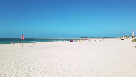 Coastline-of-the-long-white-sand-pristine-Praira-da-Barra-beach-in-autumn-from-Gafanha-da-Nazaré,-Portugal