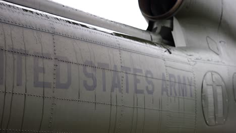Close-up-of-military-airplane-camouflage-with-United-States-army-text
