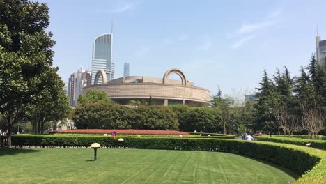 Exterior-of-Shanhai-Museum-of-Art-in-China-viewed-from-green-grass-park