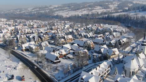 Aerial-panorama-of-traditional-mountain-village-in-Poland-on-snowy-winter