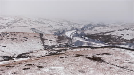 Establishing-Drone-Shot-of-Blea-Moor-Signal-Box-in-Snowy-Yorkshire-Dales