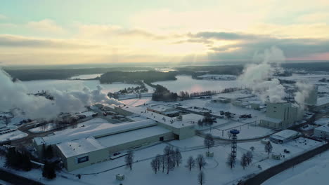 Wide-drone-shot-of-a-large-pulp-mill-in-Latvia-with-snow-covering-the-ground