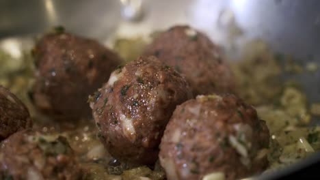 close-up-of-meatballs-cooking-in-pan-Preparing-ingredients-to-make-vegan-beyond-meatballs-with-spaghetti-and-meat-sauce