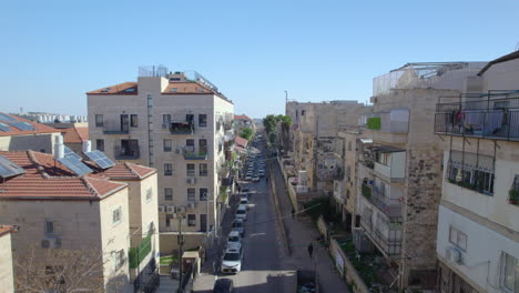 Mea-Shearim-Orthodox-Jewish-neighborhood-day-time,-Jerusalem,-Israel---one-of-the-oldest-Jewish-neighborhoods,-push-in-drone-shot