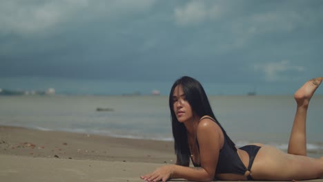 At-Vessigny-Beach-on-the-south-coast-of-the-tropical-island-of-Trinidad,-a-Latina-girl-enjoys-the-sun-in-a-bikini