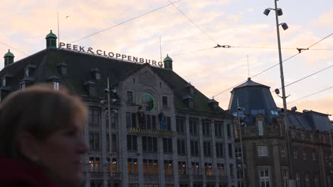 View-of-Madame-Tussaud's-museum-from-historic-Dam-Square-in-Amsterdam-at-sunset