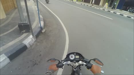 Pov-of-a-motorbike-rider-passing-by-in-the-morning-in-the-city-of-Blora,-Central-Java,-Indonesia