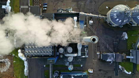 Overhead-view-of-steam-pouring-out-of-a-pulp-mill-processing-plant