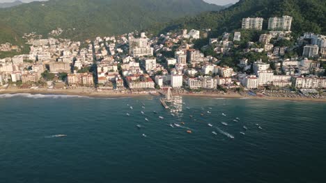 Aerial-Panoramic-Landscape-of-Puerto-Vallarta-Mexican-Beach-Ocean-Town-Summer-in-Jalisco,-Natural-Green-Hills-and-Hotels