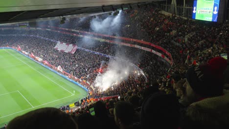 RC-Lens-football-supporters-using-pyrotechnics-inside-Emirates-Stadium