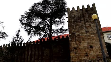 Exterior-of-Fernandine-Walls-medieval-structure-with-watchtowers-in-Porto,-Portugal