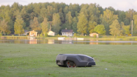 Husqvarna-315X-robotic-mower-in-action-on-beach-property-lawn