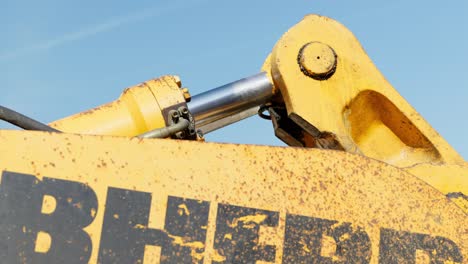 Close-up-on-hydraulic-arm-of-wheel-loader-working-on-construction-site