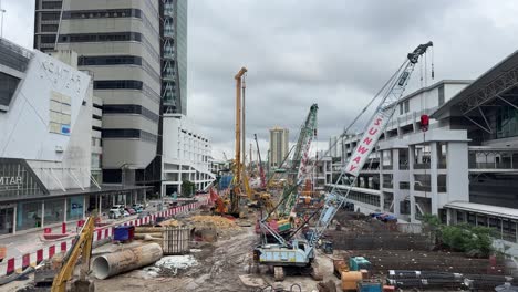 Scene-of-an-ongoing-construction-site-outside-Johor-Bahru-Sentral-Station-l-and-JB-City-Square,-a-shopping-mall-in-Johor,-Malaysia