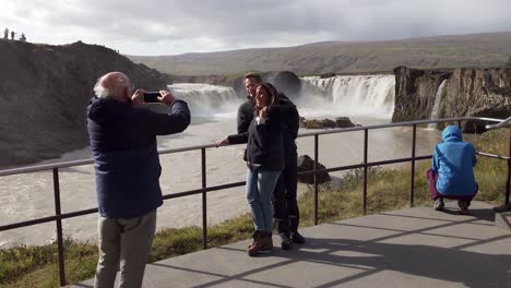 Tourists-enjoying-the-beautiful-Godafoss-waterfall-in-Iceland