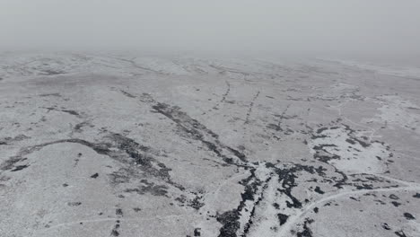 Establishing-Drone-Shot-of-Snowy-Yorkshire-Dales-on-Foggy-Misty-Day-UK