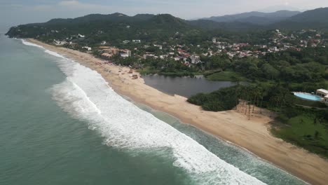 Panoramic-Aerial-Landscape-of-San-Pancho,-Mexican-Beach,-Natural-Resources-Town-Sea-and-Pacific-Ocean-Waves