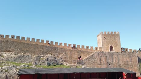 Panoramic-view-of-the-long-fortified-wall-protecting-the-historical-Óbidos-town-in-Portugal