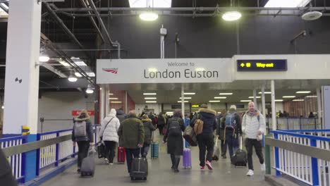 Soccer-supporters-and-mix-of-other-commuters-head-into-Euston-Station