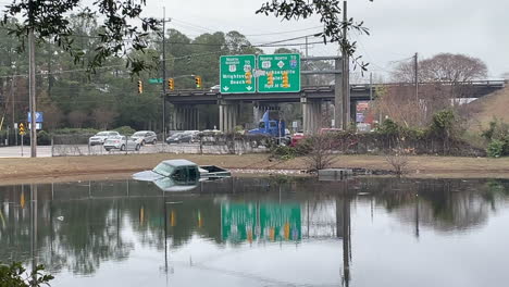 Truck-crashed-into-pond-right-off-a-busy-highway