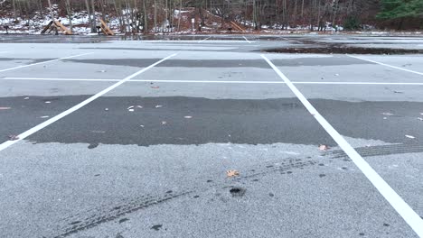 Drone-landing-in-a-frosty-cold-parking-lot-in-late-December