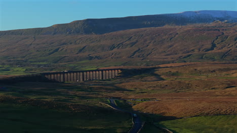 Establishing-Drone-Shot-of-Ribblehead-Viaduct-and-Whernside-in-Winter