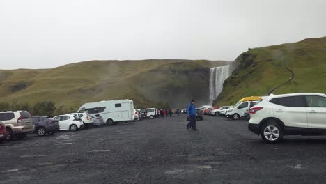 POV-car-arrival-at-the-Skogafoss-waterfall-parking-lot-on-a-rainy-day-in-Iceland