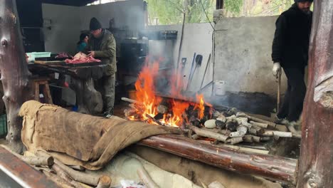 Local-people-roasting-the-curanto-in-food-fair,-Swiss-Colony,-Bariloche