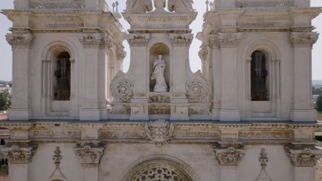Zoom-in-drone-shot-of-statue-of-the-Alcobaça-monastery-in-Portugal