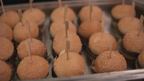 Mini-burgers-on-tray-with-toothpicks