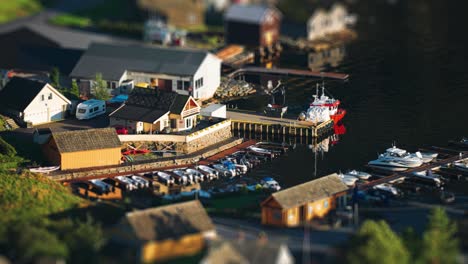A-small-tidy-harbor-in-the-village-of-Herand-with-boats-standing-at-the-dock-and-neat-boathouses