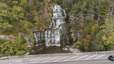 Hector-Fall-Viewing-Point---Cars-Driving-Through-Route-414-Passing-By-Hector-Falls-And-Creek
