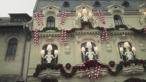 Panning-right-shot-reveals-a-Christmas-decorated-art-nouveau-building-in-Bucharest---"Mița-Biciclista"-House