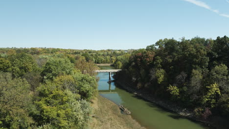 River-With-A-Small-Bridge-Near-Twin-Bridges-Park-In-Arkansas,-United-States