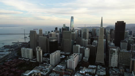 Aerial-tracking-shot-in-front-of-downtown-San-Francisco,-gloomy-sunrise-in-USA
