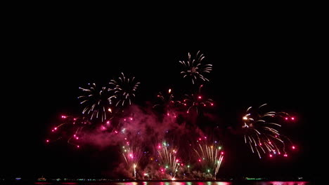Synchronized-pyrotechnic-display-during-the-Pattaya-international-Fireworks-Festival-2023,-in-Chonburi-province-in-Thailand