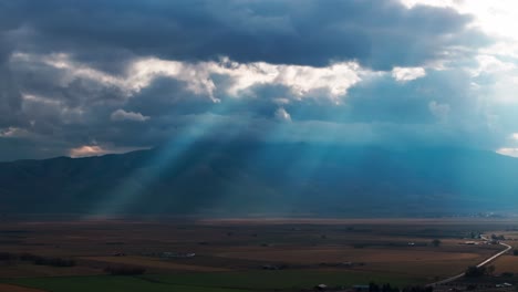 Cinematic-drone-shot-of-sunlight-rays-through-storm-clouds