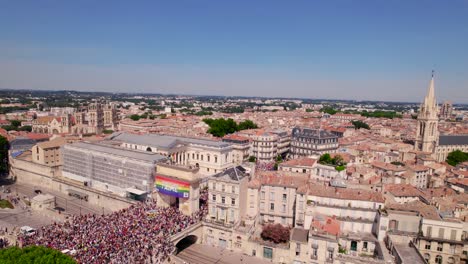 Aerial-establishing-shot-of-a-busy-gay-pride-festival-in-the-streets-of-Montpellier