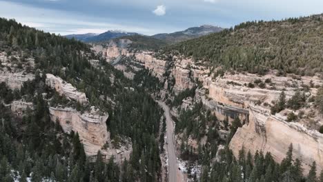 Panoramic-Aerial-View-Of-Sheer-Mountain-Walls-Of-Cedar-Canyon-State-Route-In-Utah,-USA