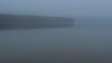 Foggy,-beautiful,-mysterious-early-spring-day-on-a-pristine-mountain-lake