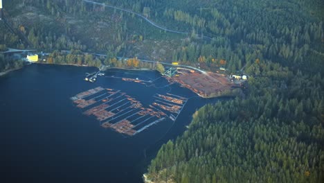 Aerial-View-of-Timber-Mill-and-Log-Raft-in-Backcountry-Nature