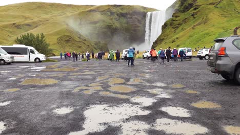 Skogafoss-waterfall-parking-lot-with-puddles-in-the-road-on-a-rainy-day---Iceland