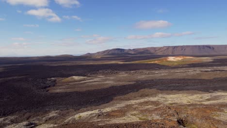 Panoramic-panning-shot-of-the-volcanic-lava-field-of-the-Leirhnjukur-volcano-eruption-in-1984-in-Northern-Iceland